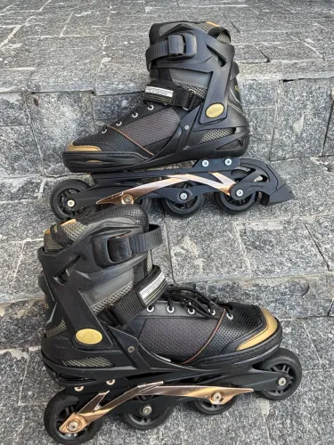 Patins woxies preto e dourado 