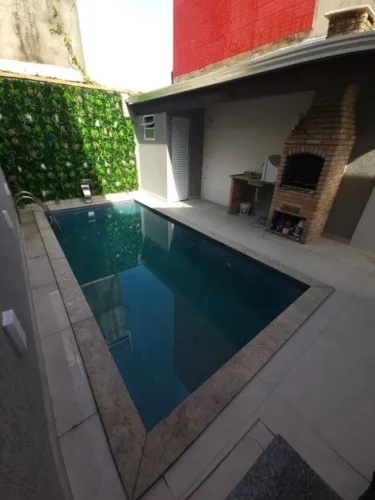 CASA GEMINADA COM PISCINA - VILA MIRIM PRAIA GRANDE SP