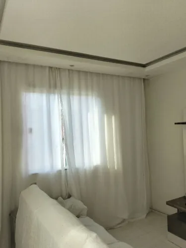 Casa com uma quitinete e um ateliê de costura