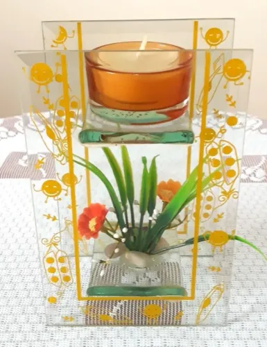 Porta Vela em Vidro com enfeite flor artificial.