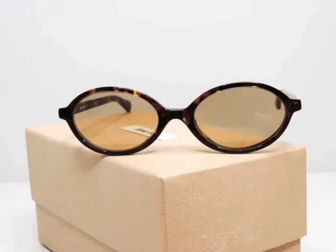 Óculos de sol Miu Miu SMU 04Z oval tartaruga original