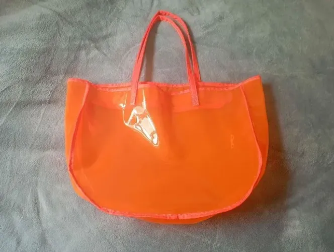 Bolsa de praia laranja fluorescente