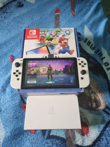 NITENDO SWITCH OLED 64GB 3 MESES DE USO SEM MARCAS DE USO NA GARANTIA LEIA A DESCRIÇÃO
