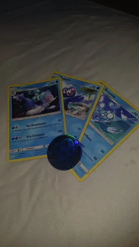 Cartas Pokémon evolução Primarina + moeda do Popplio