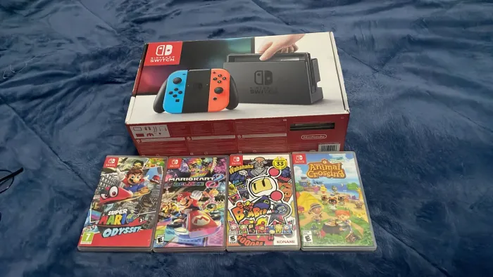 Nintendo switch V1 usado em perfeitas condições com 4 jogos com caixa e capinha e case