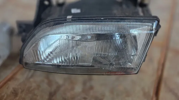 Farol esquerdo e 2 piscas laterais, escort 93 a 95