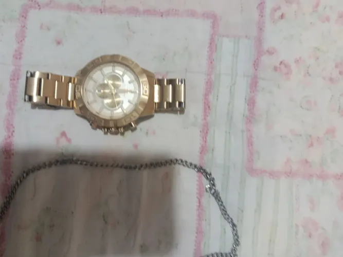 Relógio Tecnos masculino dourado e corrente de prata seminovos