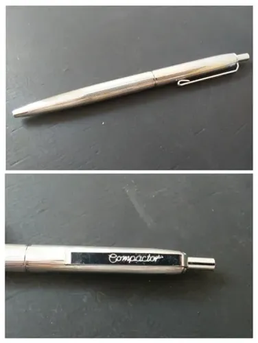 Caneta esferográfica Compactor antiga de metal, cromada e antiga. Favor ler a descrição.