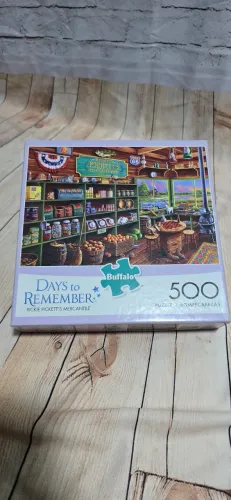 Quebra Cabeça 500 Peças - Days to Remember - Rickie Pickett's Mercantile - Buffalo (USADO)