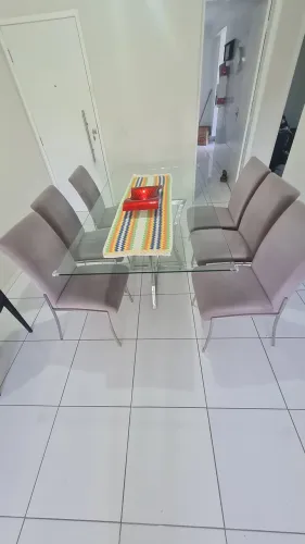 Mesa retangular de vidro,suporte inox com seis cadeiras de tecido eveludado