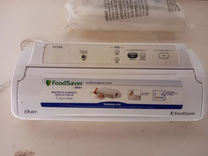 Máquina de embalar a vácuo alimentos. Marca oster