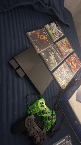 Ps2 slin na caixa mais dois memory card dois controles 6 jogos 