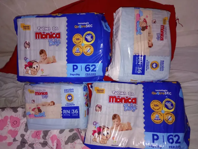 2 pacotes de fralda da turma da Monica tamanho P e Rn