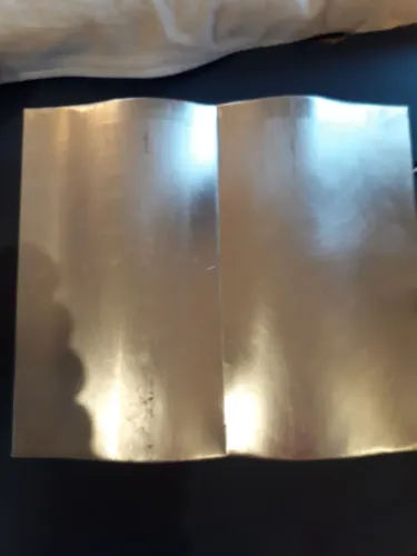 Forma de alumínio em formato de livro