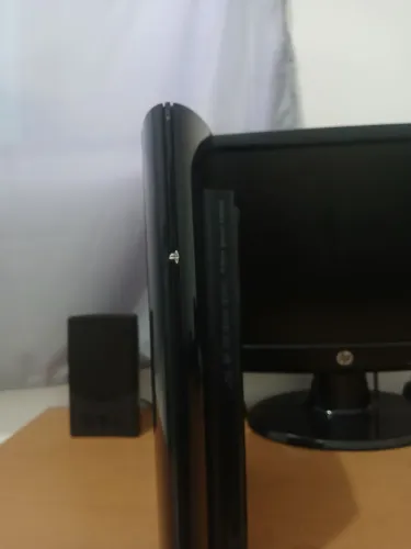 Ps3 super slim com 2 controles e 23 jogos