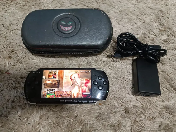 Psp modelo 3001 com 26 jogos no cartão