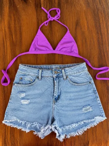 Conjunto completo: R$ 30 Parte de cima P: R$ 10 Short M: R$ 25