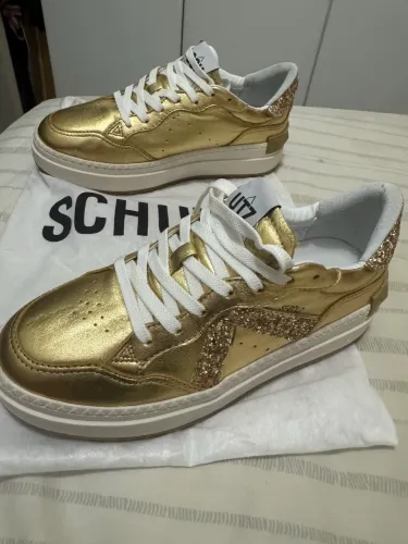 Tênis Schultz couro dourado - novo 