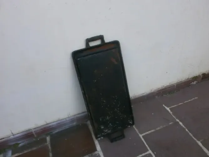 chapa de ferro fundido - colocar na boca de fogão com alça - 60x30 cm - com alça