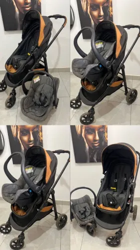 Carrinho de bebê com bebê conforto