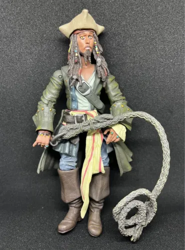 boneco jack sparrow com fundo de pedra disney