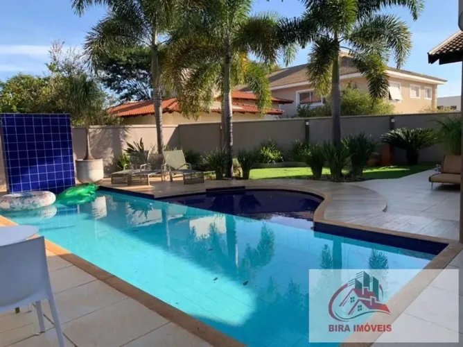 Casa com 4 dormitórios à venda, 418 m² por R$ 3.300.000,00 - Flamboyant Residencial Park -