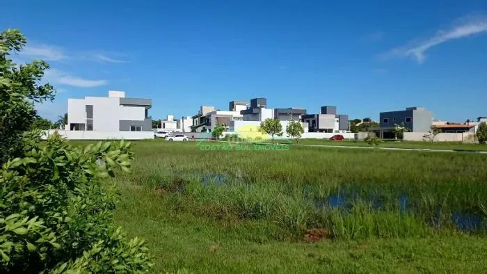 Terreno plano de 394,41m², plano, com ESCRITURA PÚBLICA, no Condomínio Caminho do Engenho