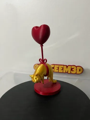 Decoração gato dourado flutuando