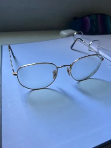Óculos hexagonal ray-ban dourado 
