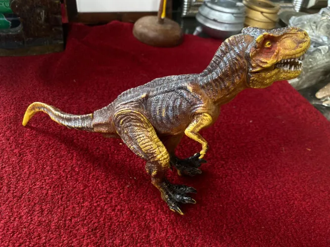 Brinquedo de dinossauro antigo articulado