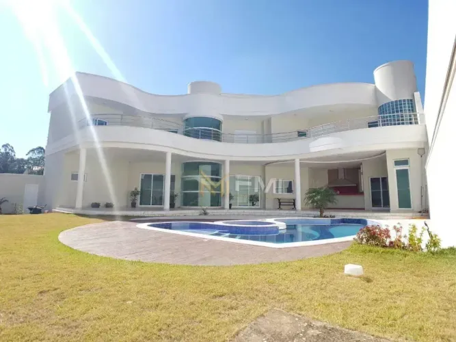 Sobrado com 4 dormitórios à venda, 690 m² por R$ 3.200.000,00 - Condomínio Flamboyant - Ho