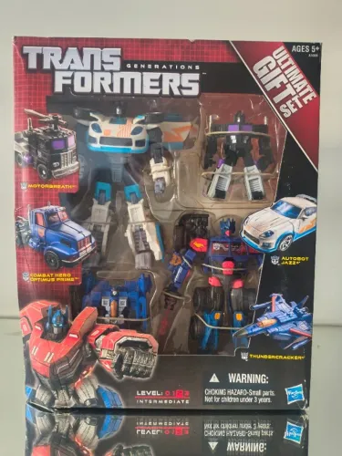 Box Transformers Generations Ultimate Gift Set lacrado - 4x figuras, Optimus Prime, Jazz +