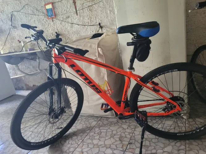 Bike Lotus aro 29 laranja refletivo pronta pra viajar