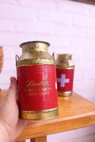 par de latas antigas chocolate suíço lindt vintage decoração antiquario colecionador arte