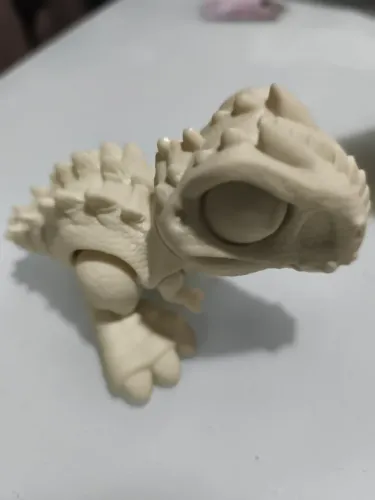 Mini tiranossauro rex articulado em resina