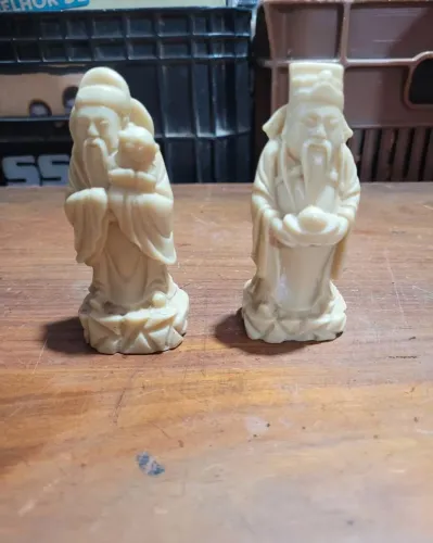Par de esculturas figuras orientais