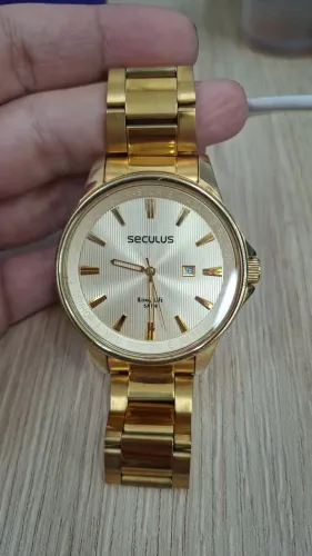 Relogio masculino dourado semi-novo