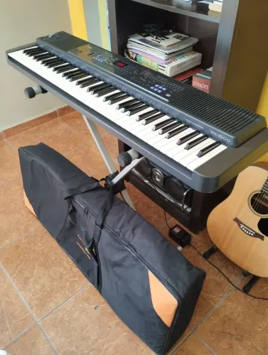Teclado arranjador Casio WK-1500, 76 teclas sensíveis com suporte e Bag