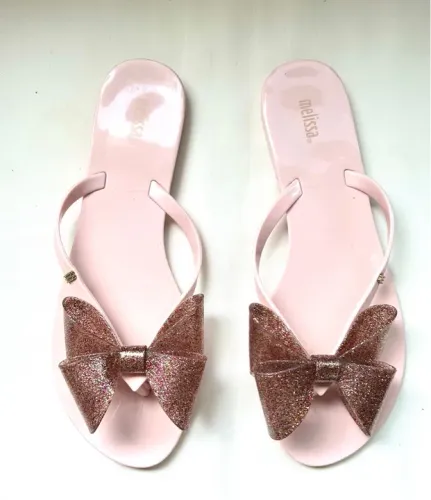 Sandálias Melissa com laço dourado