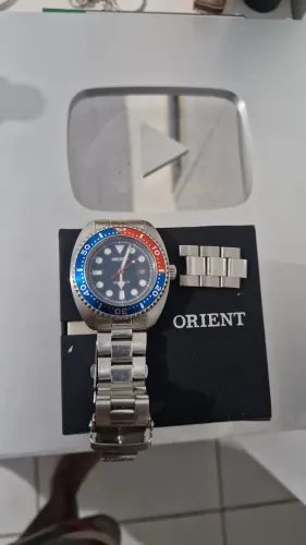 Vendo relogio orient original modelo Pepsi tec solar semi novo com caixa valor 600