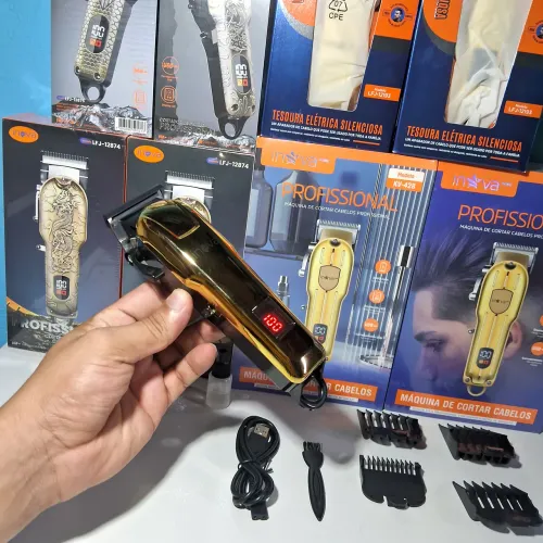 Maquina de cortar cabelo dourada