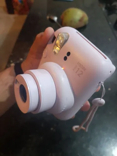 Máquina fotográfica polaroide instax,guarde os momentos como lembrança em fotos?