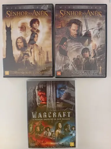 3 dvds : senhor dos anéis as 2 torres, senhor dos anéis o retorno do Rei, Warcraft