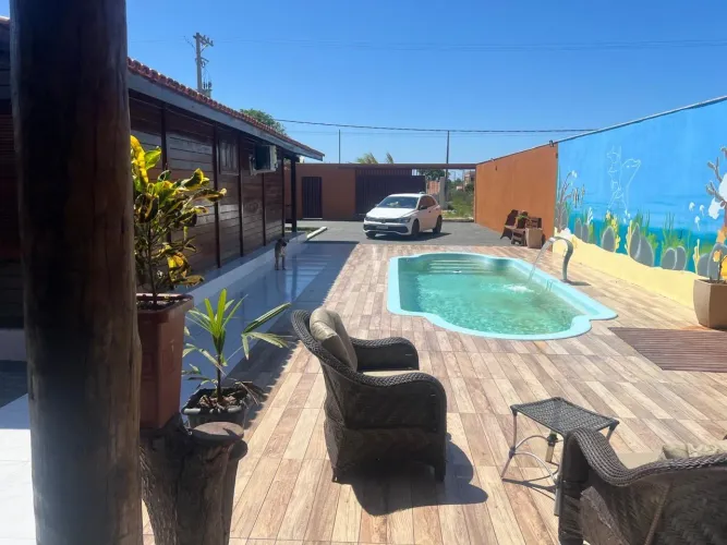Casa nova com piscina e churrasqueira a 5 min da praia de Guriri
