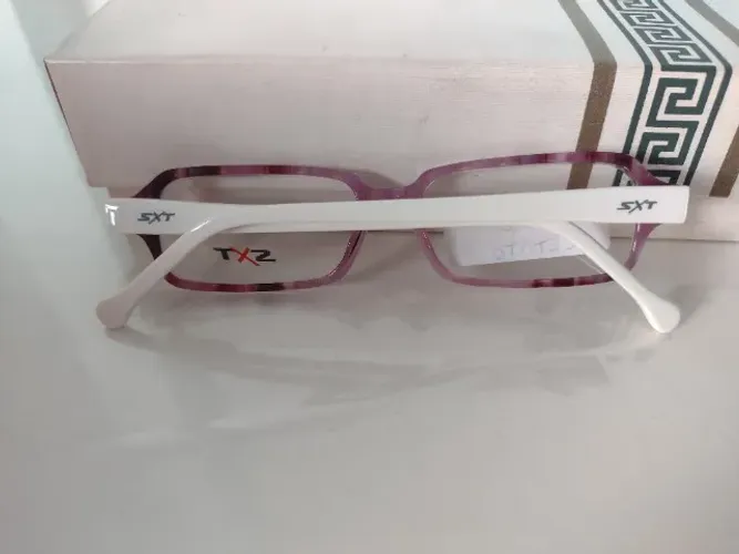 óculos infantil (armação) acetato, haste com mola cor branca, frente cores degradê 