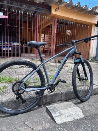 Bicicleta Aro 29 Oggi Hacker HDS Essa 8v 2026 Grafite/Azul