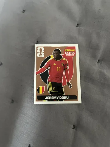 Figurinha extra sticker bronze Jeremy Doku 2026
