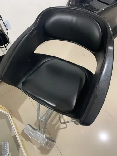 Cadeira de salão de beleza.