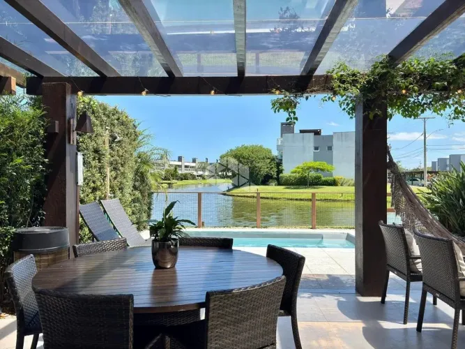 Casa condomínio Rossi Atlântida 04 dormitórios, 04 suítes 02 vagas, Beira lago