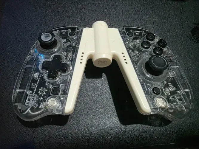 Controle Joy-Pad IINE Ergonômico Transparente (RGB) para Nintendo Switch + Grip Carregador